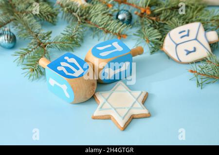 Symbols of Hanukkah and Christmas decor on color background Stock Photo