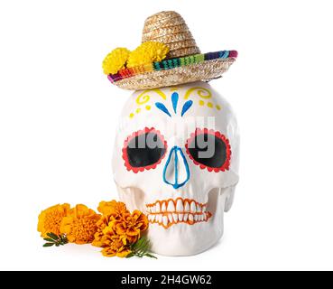 Painted human skull for Mexico's Day of the Dead (El Dia de Muertos) with sombrero and flowers on white background Stock Photo