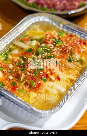 Closeup of a delicious tin foil roasted garlic cabbage Stock Photo
