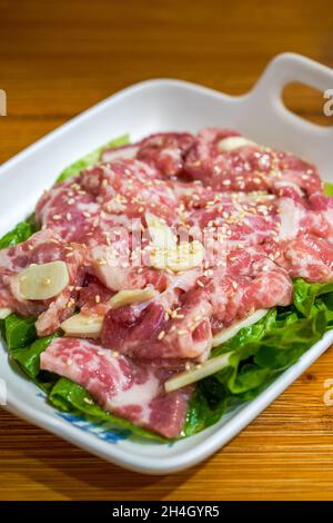 Closeup of a dish of marinated pork belly beef barbecue ingredients Stock Photo