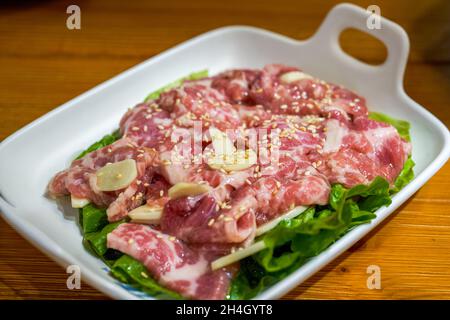 Closeup of a dish of marinated pork belly beef barbecue ingredients Stock Photo