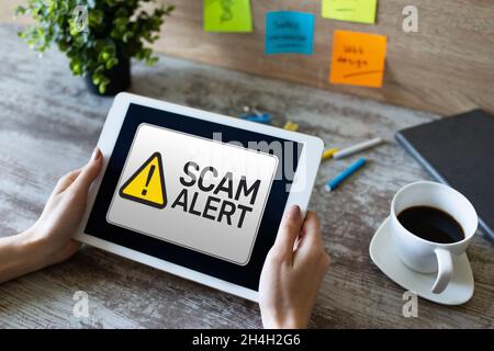 Scam alert detecting warning. Notification on device screen. Stock Photo