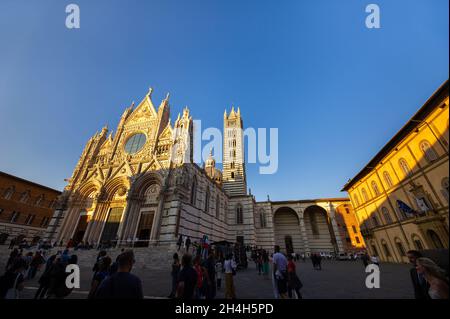 SIENA, ITALY. October 13, 2018: Sunset and view of Siena's Cathedral of Santa Maria Assunta Duomo di Siena in Siena. Stock Photo
