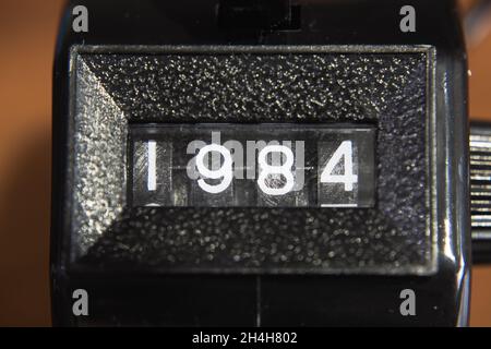 A tally counter showing a 1984 number Stock Photo