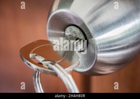 A key in a door knob Stock Photo