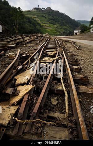 Flood disaster 2021, destroyed railway tracks next to the river Ahr with the Saffenburg, Mayschoss, Ahr valley, Eifel, Rhineland-Palatinate, Germany Stock Photo