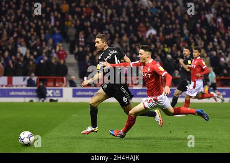 NOTTINGHAM, UK. NOV 2ND  Joe Lolley of Nottingham Forest battles with Chris Basham of Sheffield United during the Sky Bet Championship match between Nottingham Forest and Sheffield United at the City Ground, Nottingham on Tuesday 2nd November 2021. (Credit: Jon Hobley | MI News) Stock Photo