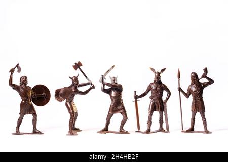 Vintage toy Brown Viking soldiers isolated on white background. Stock Photo