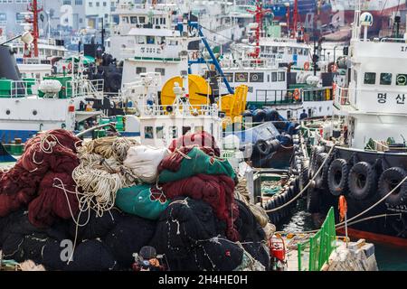 Busan, South Korea - March 24, 2016:Sea mooring with fishing tackles and the ships at it. Stock Photo