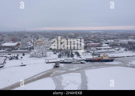 Arkhangelsk, Russia - January 7, 2021:The city on river bank, in the winter, is photographed from above. Stock Photo