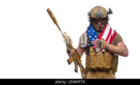 American soldier stands against white background with a flag. Concept ...