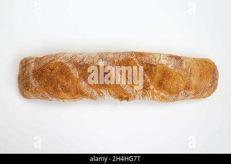 french baguette isolated on white background, loaf of crusty bread, fresh pastries, top view Stock Photo