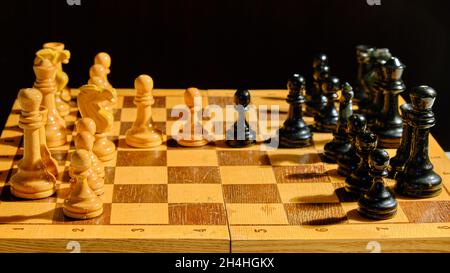 The opening of the chess game French defense, black background Stock Photo  - Alamy