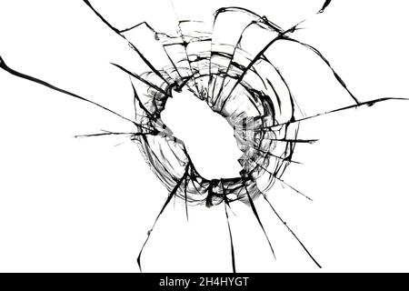 Cracks from a bullet in the glass. Broken glass shot. Abstract texture on white background Stock Photo