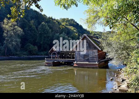 Mureck, Austria - September 24, 2021: Old ship mill on the river Mur in Styria, such mills were already used by the ancient Romans, the river forms th Stock Photo