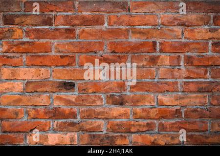 Background of an old red clay brick wall surface, old worn grunge texture Stock Photo