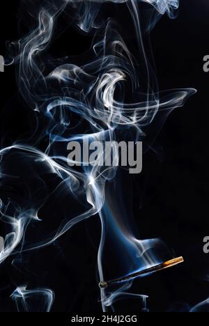 Extinguished and smoking match, Match extinguished and smoking Stock Photo