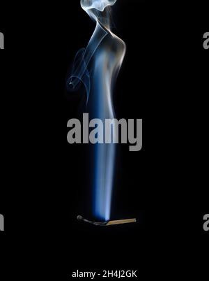 Extinguished and smoking match, Match extinguished and smoking Stock Photo