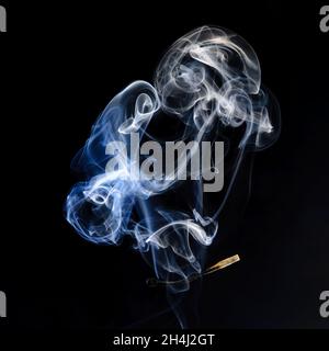 Extinguished and smoking match, Match extinguished and smoking Stock Photo