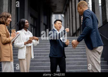 Multiracial business team bumping fists each other Stock Photo