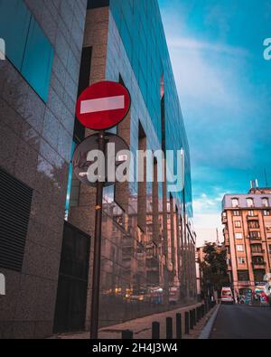 BUCHAREST, ROMANIA - Sep 01, 2021: A traffic sign against a glass building Stock Photo