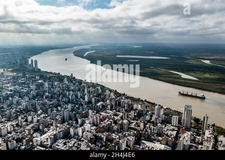 Aerial shot of buildings and river over Rosario city. Stock Photo