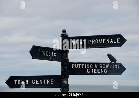 an old iron sign at cromer with directions to local locations and entertainment cromer norfolk england UK Stock Photo