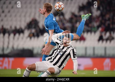 Dmitri Chistyakov of Zenit and Alvaro Morata of Juventus FC compete for the ball during the Uefa Champions League group H football match between Juventus FC and Zenit ST Petersburg at Juventus stadium in Torino (Italy), November 2nd, 2021. Photo Federico Tardito / Insidefoto Stock Photo