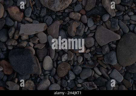 top view photo of pebbles and stones on the beach Stock Photo