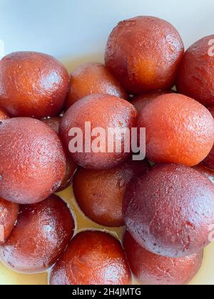 Top view of a bowl full of traditional Indian sweet called Gulab Jamun or Kala Jaam Stock Photo
