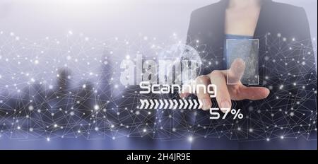 Global world telecommunication network. Hand touch digital screen hologram scanner and world sign on city light blurred background. Futuristic technol Stock Photo