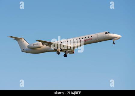 Loganair Embraer ERJ-145EP airliner jet plane G-RJXH on approach to land at London Heathrow Airport, UK, in clear blue sky Stock Photo