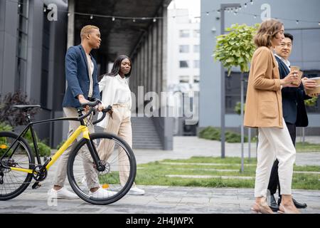 Business team in medical masks walking and talking Stock Photo