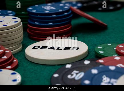 stack of Poker chips and dealer button Stock Photo