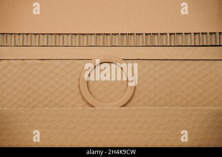textured recycled cardboard background pattern with circle Stock Photo