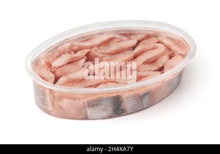 Pieces of pickled atlantic herring in open plastic container isolated on white Stock Photo