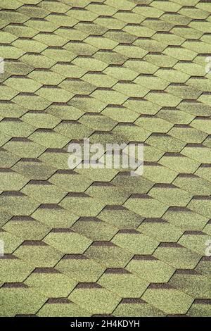 Black bitumen shingles on .the roof. close-up Stock Photo