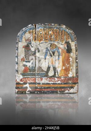 Ancient Egyptian stele the lady Nestarout led by the god Thoth before the god Atoum, circa 900 BC, 3rd Intermediate Period, painted wood. The Louvre M Stock Photo