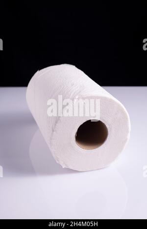 roll of white paper towels napkins on white table Stock Photo