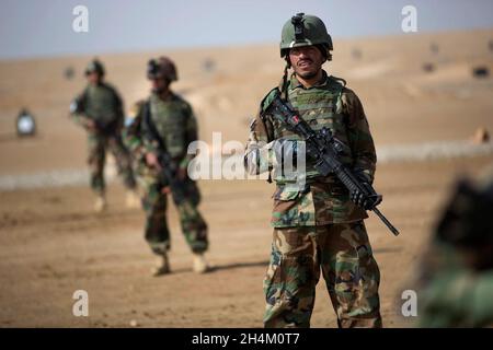 HELMAND PROVINCE, AFGHANISTAN - 02 February 2013 - Afghan Commandos from 3rd Company, 7th Special Operations Kandak participate in react to fire drill Stock Photo