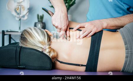 IASTM mysofacial Release For Rhomboid And Back Pain Using Smart Tools Stock Photo
