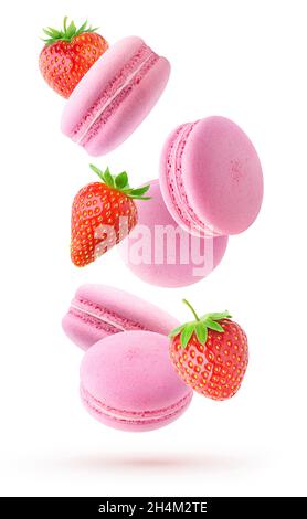Isolated fruit macaroons. Falling pink macaroons and fresh straberries isolated on white background Stock Photo