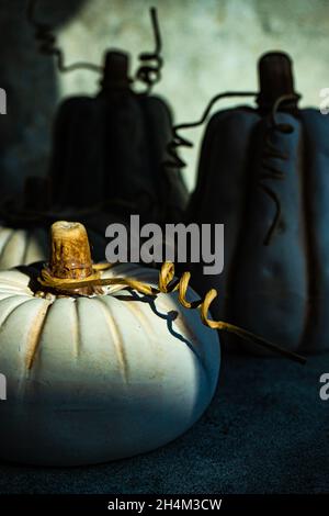 Festive place setting for Thanksgiving celebration with ceramic handmade pumpkins with sun shadows