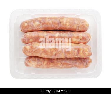 Pork sausages in a plastic packaging tray isolated on a white background Stock Photo