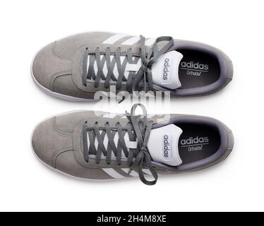 MOSCOW, RUSSIA - June 25, 2020: Adidas sneakers for running, football, training and skateboarding in white and gray, showing the Adidas logo and famou Stock Photo