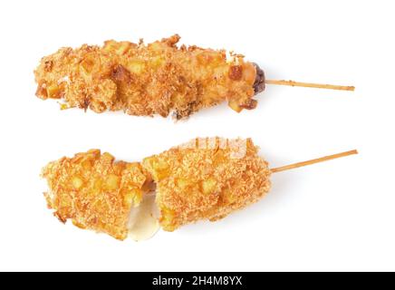 Delicious crunchy korean style chunky corn dogs with batter and fried potatoes isolated on a white background Stock Photo