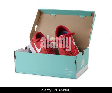 SAMARA, RUSSIA - December, 2020: Red Nike shoes in aquamarine box isolated on white background. Stock Photo
