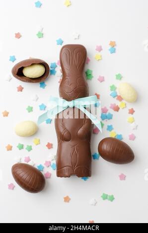 Easter chocolate bunny with chocolate eggs on white background Stock Photo