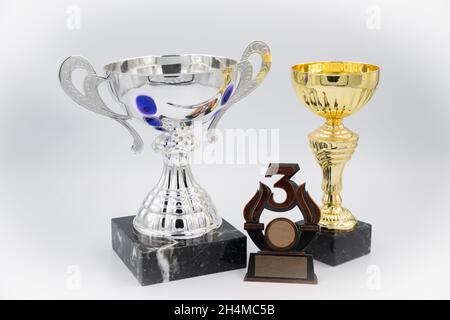 three different kind of  trophies. Isolated on white background Stock Photo