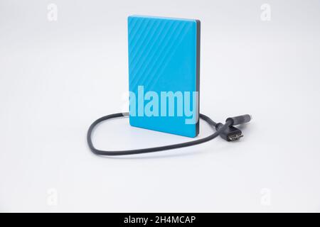 Blue external hard drive for data storage and security - isolated on white background Stock Photo
